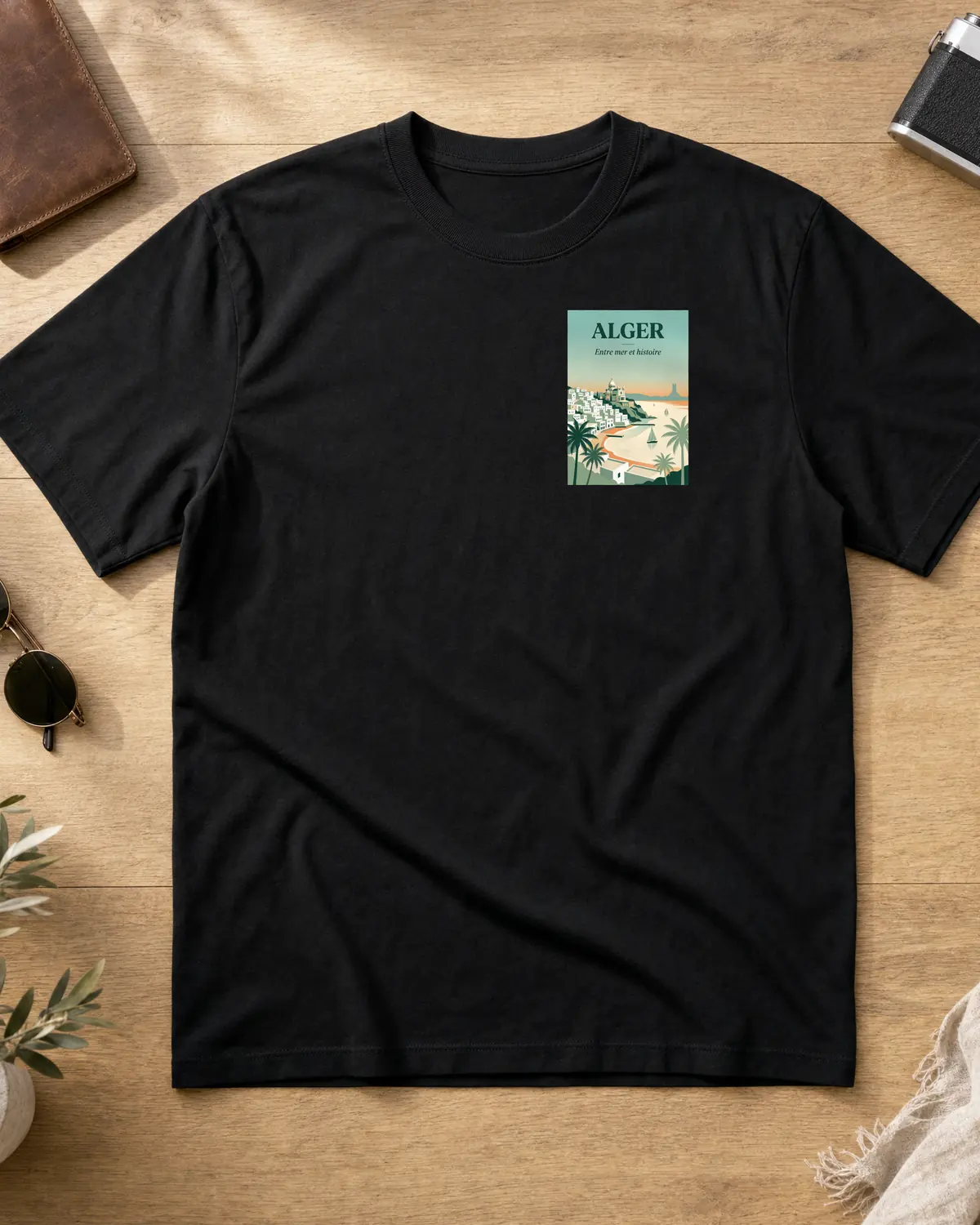 Black Alger t-shirt front with a small framed travel-poster patch on the chest — Bay of Algiers